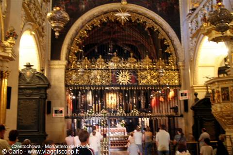 Golden chapel of the Black Madonna in Częstochowa, faithful praying inside