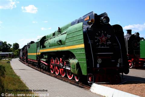 Green steam locomotive with red star at the Brest railway museum