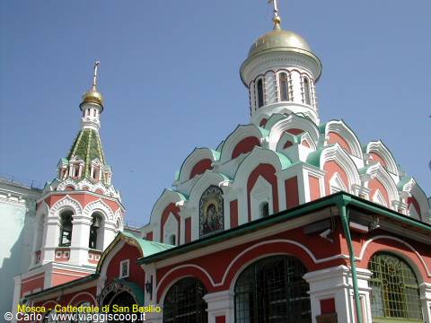 Church with gilded domes and red and white walls, Moscow