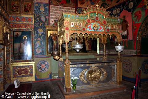 St Basil's Cathedral, Moscow: gilded tomb under ornate canopy, among colorful frescoes