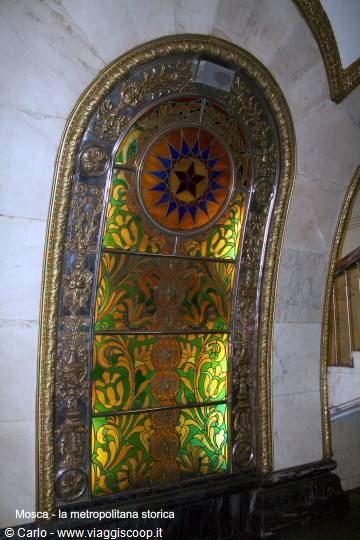 Stained glass panel with red star in gilded mosaic frame, Novoslobodskaya metro