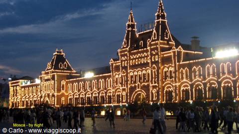 Night lights on GUM department store, crowd on Red Square