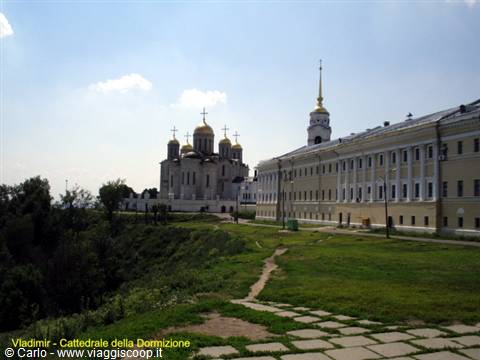 Dormition Cathedral in Vladimir, golden domes beside the yellow building