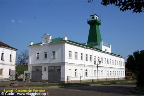 Suzdal, white fire station with green tower under a blue sky