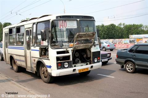 City bus with open hood on a street in Yaroslavl