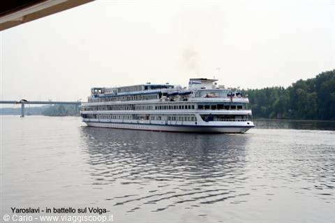 White three-deck river cruise ship sailing the Volga at Yaroslavl, grey sky