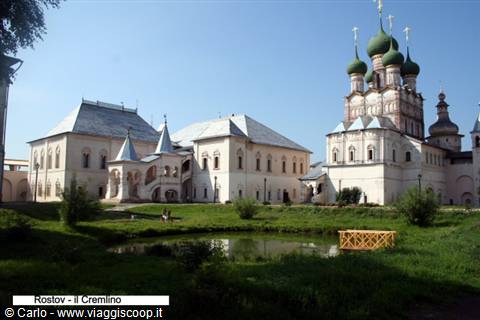Rostov Veliky Kremlin: white churches with green onion domes and pond
