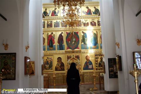 Nikolsky Monastery, Pereslavl: woman praying before the golden iconostasis