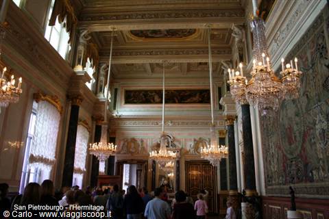 Gilded hall with crystal chandeliers and tapestries at the Hermitage, Saint Petersburg