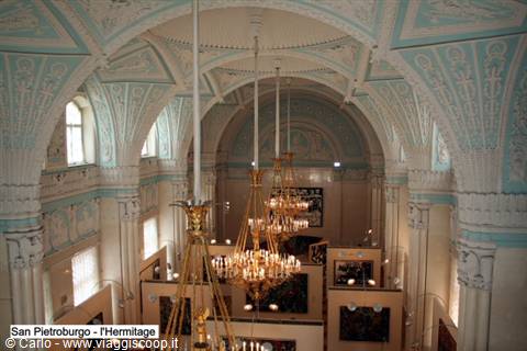 Golden chandeliers under decorated vaults inside the Hermitage, Saint Petersburg