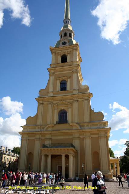 Tourists admire the Saints Peter and Paul Cathedral in Saint Petersburg