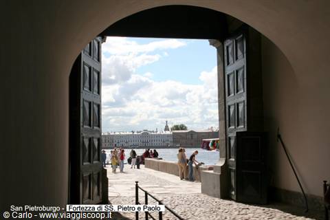 Gate of SS Peter and Paul Fortress, tourists walking toward the river