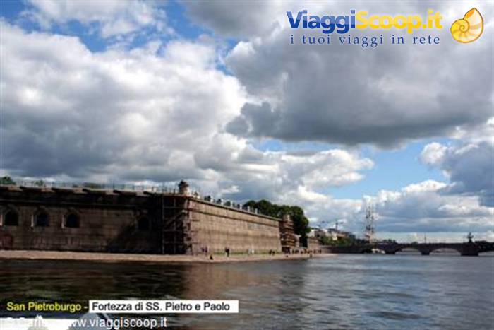 Granite walls of the Peter and Paul Fortress on the Neva under heavy clouds