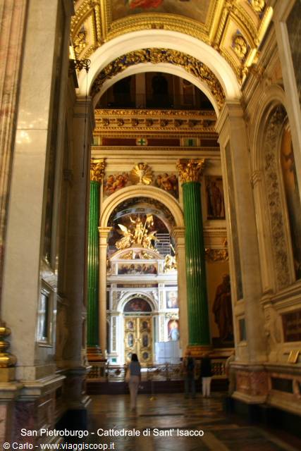 Green malachite columns and golden iconostasis inside St Isaac's Cathedral, Saint Petersburg