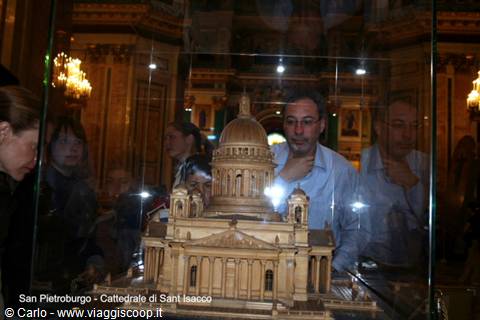Wooden model of Saint Isaac's Cathedral under glass, reflected visitors