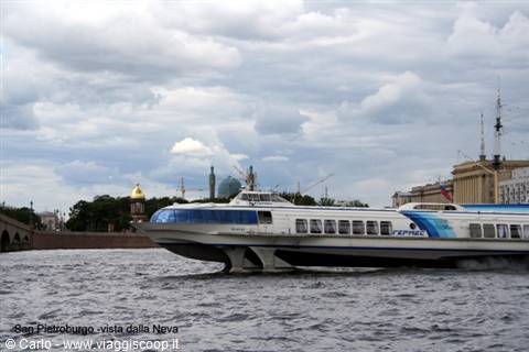 White and blue Meteor hydrofoil on the Neva, cloudy sky over Saint Petersburg