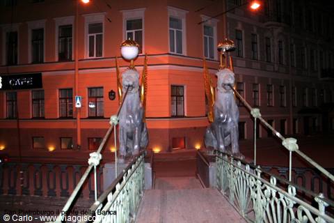 Bank Bridge in Saint Petersburg: golden griffins lit at night