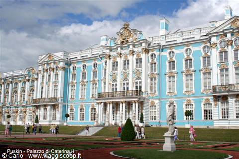 Catherine Palace in Pushkin, blue facade with gilded ornaments under cloudy sky