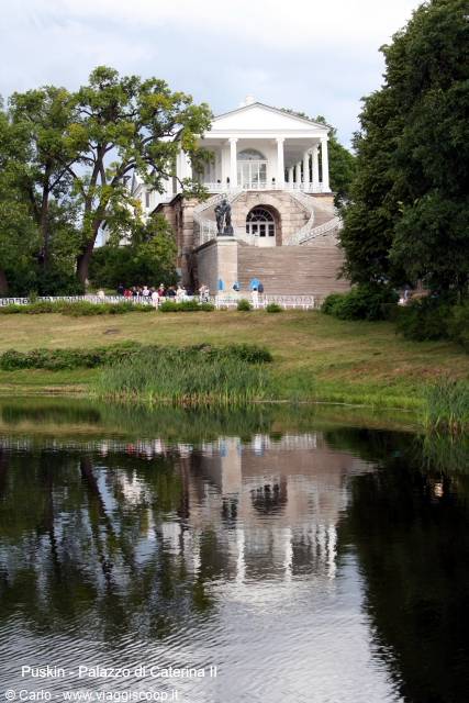 Tourists on the Cameron Gallery staircase in Pushkin, reflected in the pond