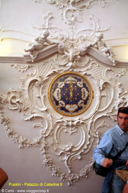 Blue gilded clock set in white stucco ornaments, Catherine Palace in Pushkin