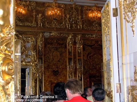 Tourists admire the gilded interiors of the Catherine Palace in Pushkin