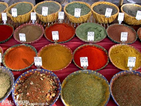 Bowls of colorful spices at the Arles market, Camargue