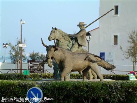 Bronze statue of a Camargue gardian on horseback facing a bull, Saintes-Maries-de-la-Mer