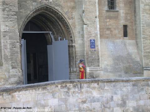 Woman in Provençal costume by the entrance of the Popes' Palace, Avignon