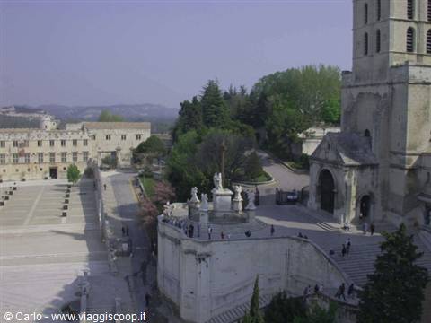 Avignon cathedral in Provence, pale stone square with visitors