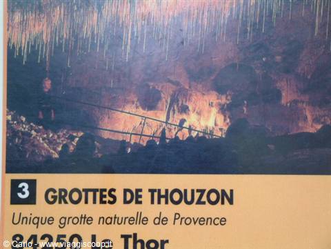 Grottes de Thouzon, illuminated stalactites in the cave, visitors on the pathway