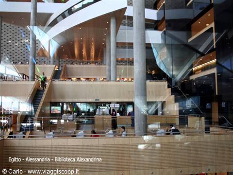 Inside the Bibliotheca Alexandrina: readers among ramps, stairs and curved wooden ceiling