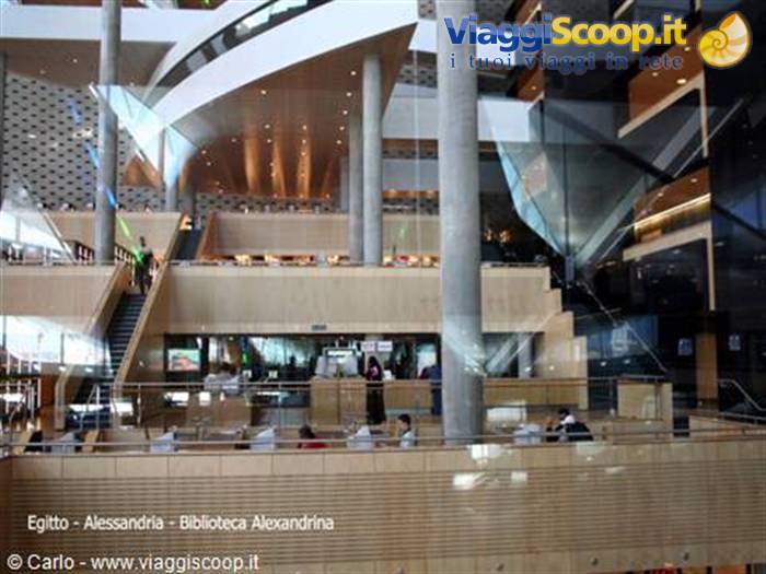 Inside the Bibliotheca Alexandrina: readers among ramps, stairs and curved wooden ceiling