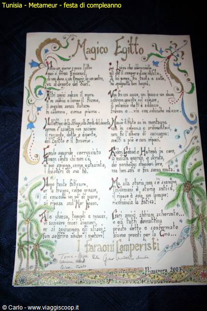 Illuminated parchment 'Magico Egitto' with decorated calligraphy and palm trees, party in Metameur