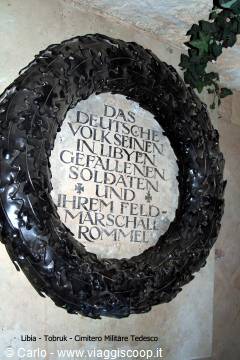 Dark metal wreath with German inscription at Tobruk German Military Cemetery