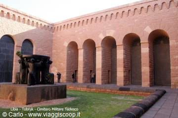 Tobruk Italian War Cemetery: bronze sculpture among brick walls and arches
