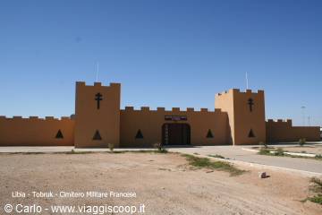 French military cemetery in Tobruk, ochre crenellated walls in the desert