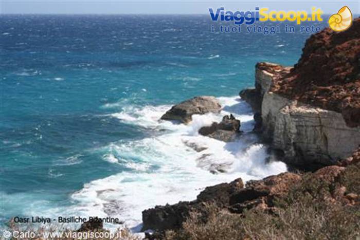 Turquoise waves crash on the limestone cliffs near the Basilicas Pitiantine
