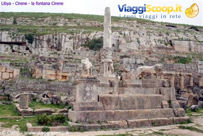 Fountain of Cyrene: stone lions and column among Greek ruins
