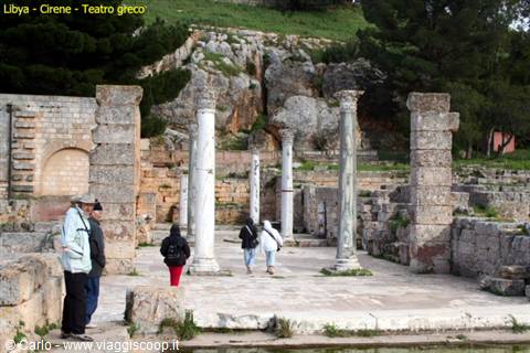 Tourists among marble columns of the Roman theater in Cyrene
