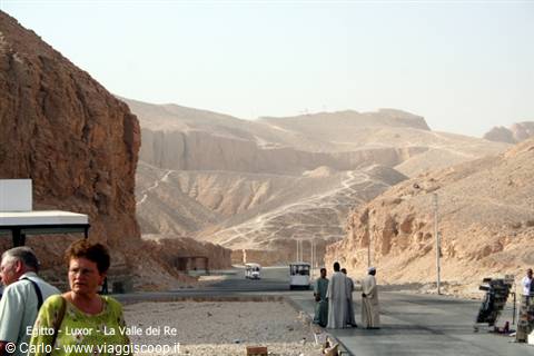 Valley of the Kings at Luxor: tourists and shuttles among arid rocky hills