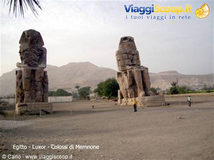 Colossi of Memnon in Luxor, seated pharaoh statues under morning haze