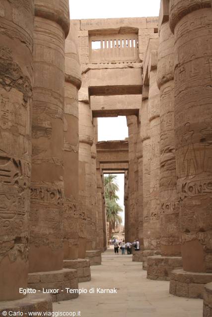 Giant carved stone columns in the hypostyle hall of Karnak Temple, Luxor