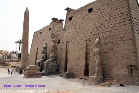 Luxor Temple: obelisk and Ramses II colossi among massive ancient sandstone walls