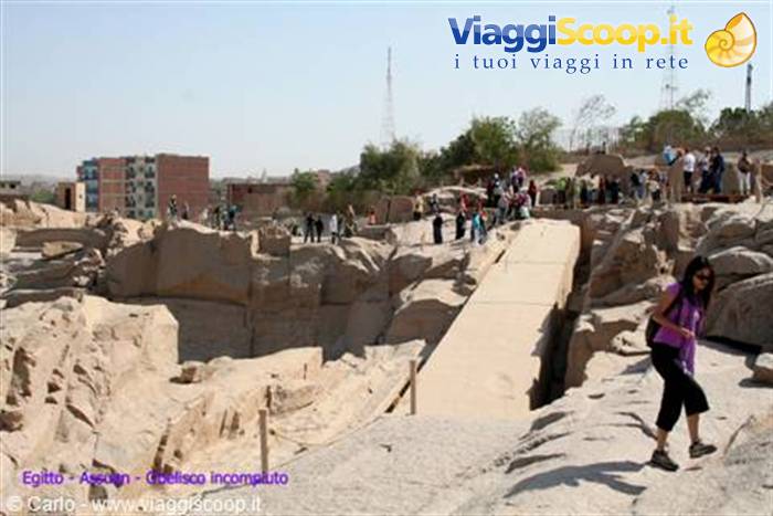 Tourists in the granite quarry of Aswan around the unfinished obelisk