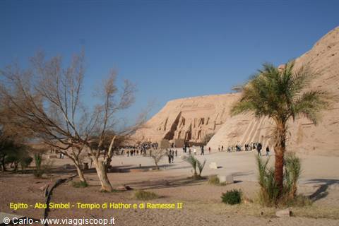 Tourists in front of the rock-cut facade of the Great Temple of Abu Simbel