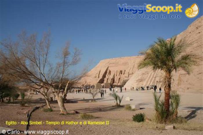 Tourists in front of the rock-cut facade of the Great Temple of Abu Simbel