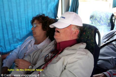 Tourists sleeping on bus seats from Abu Simbel to Aswan
