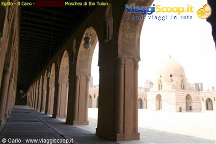Ibn Tulun Mosque, Cairo: brick arcade arches toward the courtyard and dome