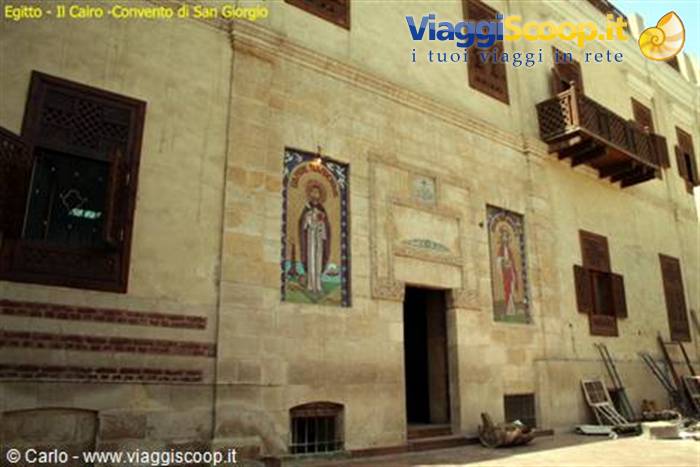 Saint George Convent facade in Cairo, religious icons on pale stone wall