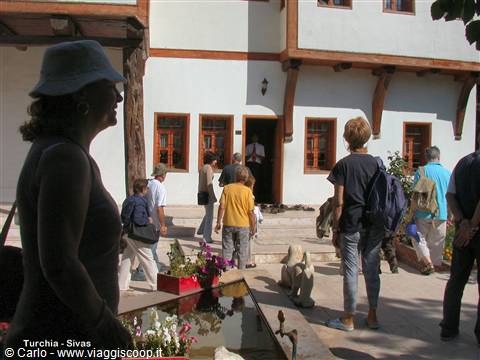 Tourists in front of an Ottoman timber and white house in Sivas